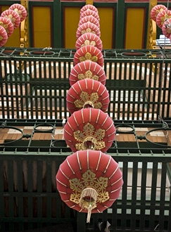 China Town Prints: USA, California, San Francisco. Strings of red Chinese lanterns hanging from a balcony