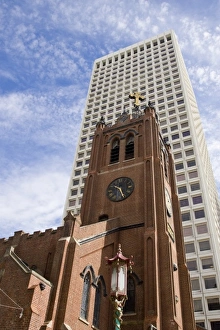 USA, California, San Francisco. Old St. Marys Cathedral and modern skyscraper