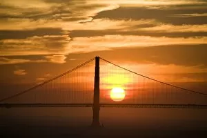 USA. California. San Francisco. Sun setting behind the Golden Gate bridge