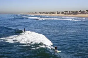 USA, California. Sunny summer views from atop the Huntington Beach Pier. Some of