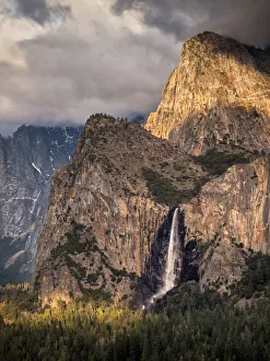 Sierras Prints: USA, California, Yosemite National Park, The setting sun lights up Bridalveil Fall