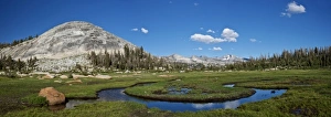 USA, California, Yosemite National Park. An erratic boulder sits in a glacial tarn