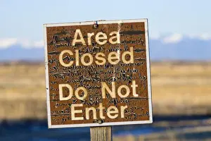 Warning Prints: USA, Colorado. An aged warning sign in the Monte Vista National Wildlife Refuge