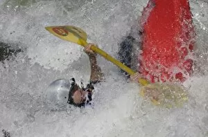 USA, Colorado, Arkansas River, Salida. Female kayaker in a river hydraulic called