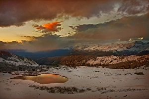 Tarn Prints: USA, Colorado, Cottonwood Pass. Sunset on alpine tarn ringed with fresh snow. Credit as