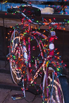 Images Dated 19th December 2011: USA, Colorado, Crested Butte, Elk Avenue, bicycle covered in colored lights