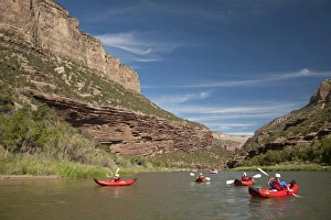 Green River Prints: USA, Colorado, Dinosaur National Monument, Green River, children in kayaks. (MR)