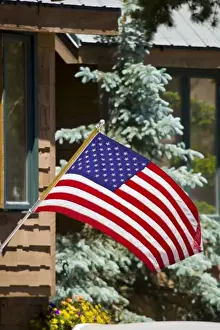 Parade Prints: USA, Colorado, Frisco. American flag waves in front of home on July FourthFred J