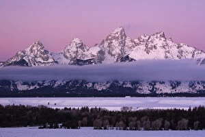 Images Dated 18th February 2007: USA Colorado Grand Teton NP mountains with layer of fog at twilight