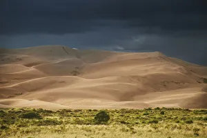 Prints of USA, Colorado, Great Sand Dunes National Park. Thunderstorm over sand dunes near sunset. Credit as: Don Grall / Jaynes Gallery / DanitaDelimont.com Images Dated 2017 December: USA, Colorado, Great Sand Dunes National Park. Thunderstorm over sand dunes near sunset