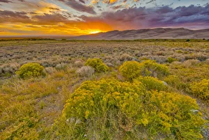Images Dated 24th September 2018: USA, Colorado, Great Sand Dunes National Park and Preserve. Sunset over dunes and plain