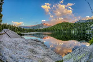 Images Dated 26th June 2018: USA, Colorado, Rocky Mountain National Park. Longs Peak reflects in Bear Lake at sunset