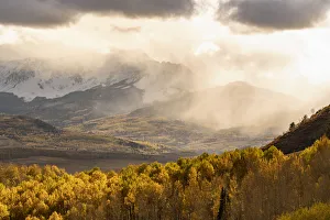 Images Dated 3rd November 2018: USA, Colorado, San Juan Mountains. Snow flurries over mountain and valley at sunset