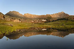 USA, Colorado, Uncompahgre National Forest. Three Needles mountains reflect in mountain pond