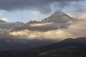 Images Dated 16th January 2022: USA, Colorado, Uncompahgre National Forest. Sunrise on clouds below Mount Sneffels