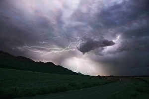 Images Dated 29th July 2015: USA, Colorado, Upper Arkansas River Valley. Lightning storm over mountain. Credit as