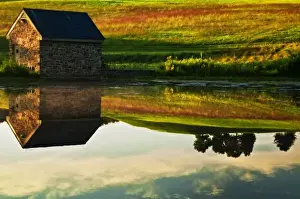 Rustic Prints: USA, Delaware, Wilmington. Stone barn on edge of lake in Winterthur Gardens