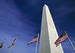 Images Dated 16th April 2008: USA, District of Columbia. American flags fly at the base of the Washington Monument