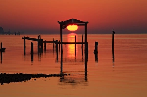 USA; Florida; Apalachicola; Old boat house at sunrise on Apalachicola Bay