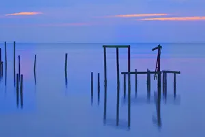 Images Dated 10th February 2019: USA, Florida, Apalachicola. Remains of an old dock at sunrise