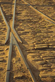 Railroad Prints: USA, Georgia, Savannah. Old railroad tracks along ballast stones at River Street