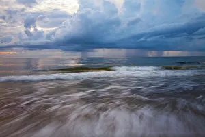 Images Dated 19th March 2022: USA, Georgia, Tybee Island. Sunrise with clouds and reflections along the coast