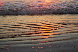 Images Dated 29th March 2022: USA, Georgia, Tybee Island. Sunrise with ripples in the sand