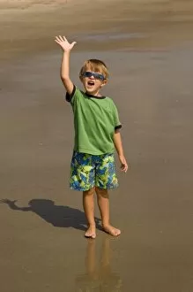 USA; Georgia; Young boy playing on the beach at Tybee Island GA. (MR)