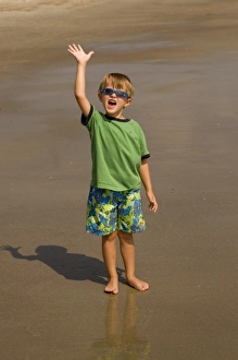Images Dated 16th September 2006: USA; Georgia; Young boy playing on the beach at Tybee Island GA. (MR)