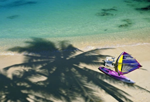Shade Prints: USA, Hawaii. Chair and windsurfer on beach