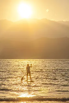 Exercise Prints: USA, Hawaii, Kauai, Hanalei bay with paddle boarder at sunset