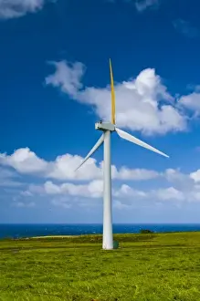 Turbine Prints: USA, Hawaii. Single windmill with Pacific Ocean and puffy clouds in background