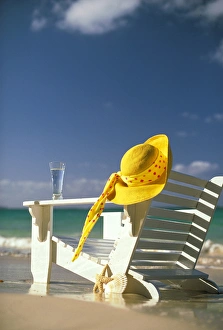 Starfish Prints: USA, Hawaii. Sun hat and lounge chair on beach