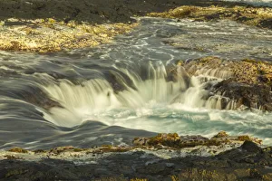 USA, Hawaii, Wawaloli Beach Park. Scenic of The Well cascade
