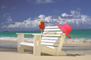 USA, Hawaiian Islands. Beach chair, cocktail and sun hat