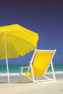 Images Dated 16th March 2007: USA, Hawaiian Islands. Beach chair and umbrella on beach