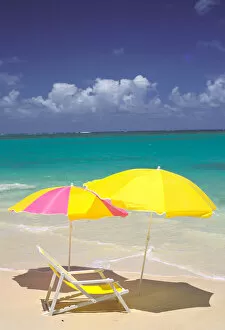 USA, Hawaiian Islands. Beach chair and umbrellas