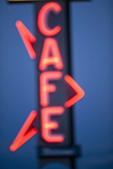 Retro Prints: USA, Idaho, Arco, Neon Cafe sign at dusk
