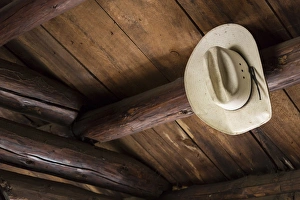 Cabin Prints: USA, Idaho. Cowboy hat in abandoned cabin