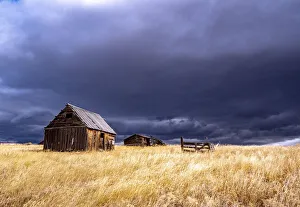 USA, Idaho, Highway 36, Liberty storm passing over old wooden barn