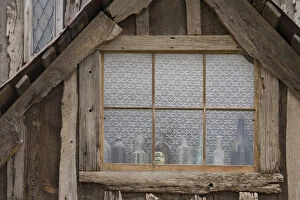 USA, Idaho, Idaho City. Old building with dusty bottles in window. Credit as: Don