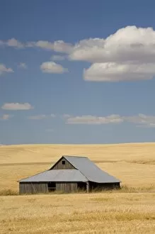 USA, Idaho, The Palouse, Old barn, farmland, and clouds