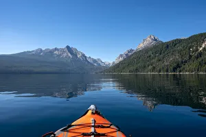 Kayak Prints: USA, Idaho, Redfish Lake. Kayak facing Sawtooth Mountains