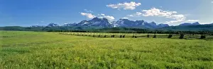 USA, Idaho, Sawtooth NRA. A split-rail fence extends to the Sawtooth Range at Sawtooth NRA, Idaho