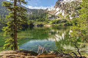 USA, Idaho, Sawtooth Wilderness. Mountain reflects in Alpine Lake