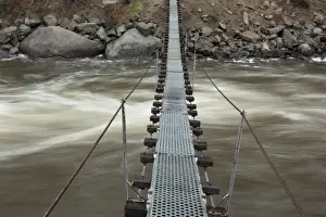 Pathway Prints: USA, Idaho, Smiths Ferry, Footbridge over rapids on Payette River