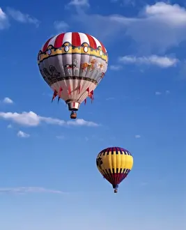 Carousel Prints: USA, Idaho, Teton Valley. Colorful hot-air balloons are suspended in air above Teton
