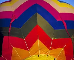 USA, Idaho, Teton Valley. The wildly-colored fabric of this hot-air balloon spices