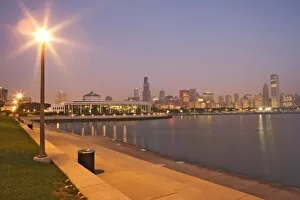 USA, Illinois, Chicago. Skyscrapers and Lake Michigan at twilight
