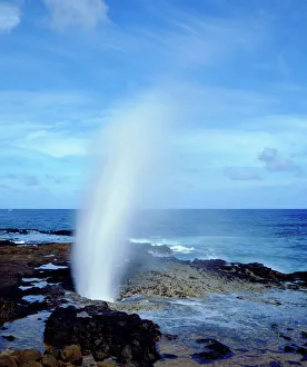 Seascape Prints: USA; Kauai Hawaii; A blow hole spouts seawater on Kauai